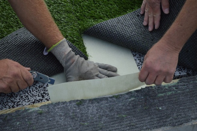Greenwich artificial turf installation - cushion pad installation